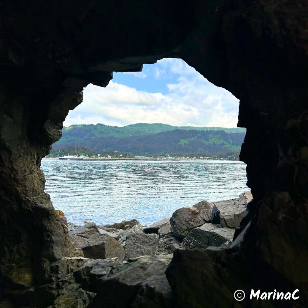 Looking through the rock formations at Seldovia and the Tustumena ferry from Hoen’s Lagoon